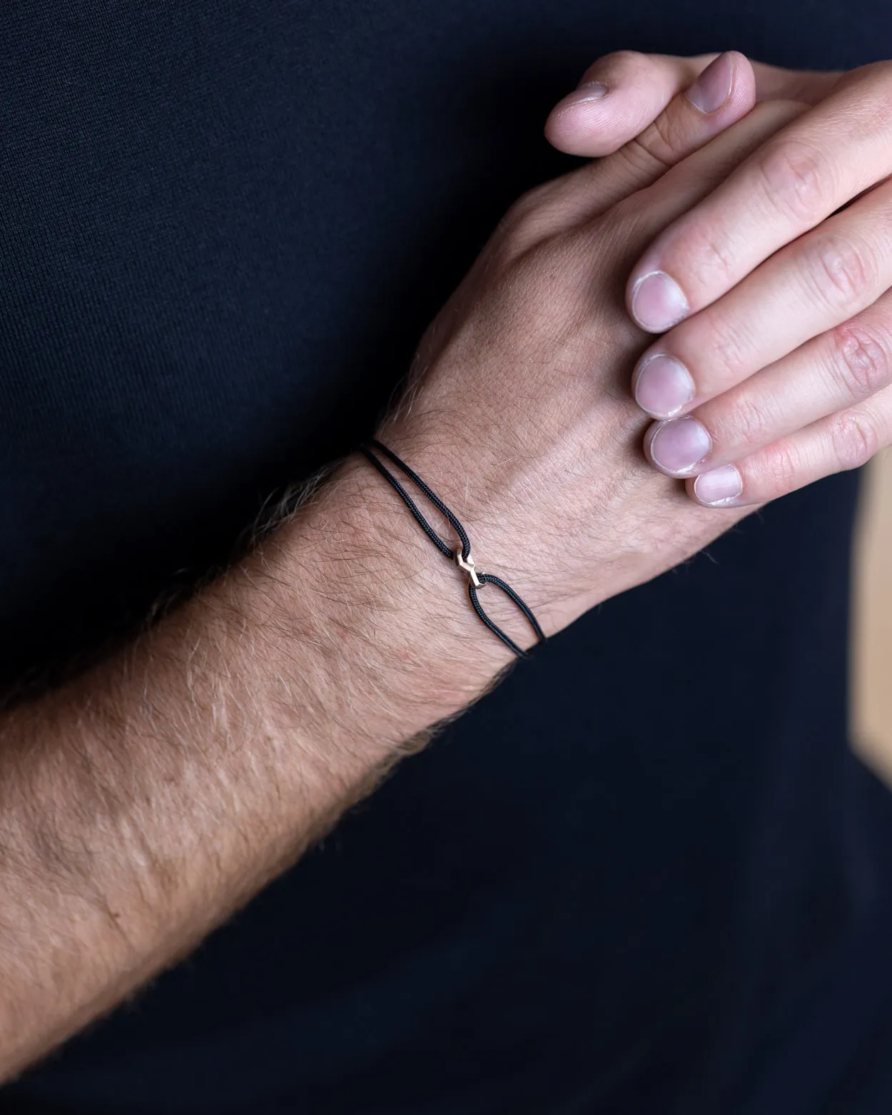 1.5mm Black nylon bracelet with a bronze-plated Infinity sign