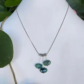 3 petal pivot emeralds necklace